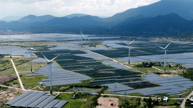 Aerial view of wind turbines and solar panels in Vietnam coastal region